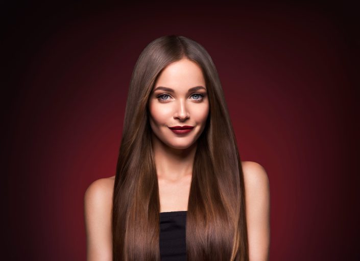 Beautiful hair woman long smooth brunette hairstyle beauty healthy hair female model portrait.  Studio shot.